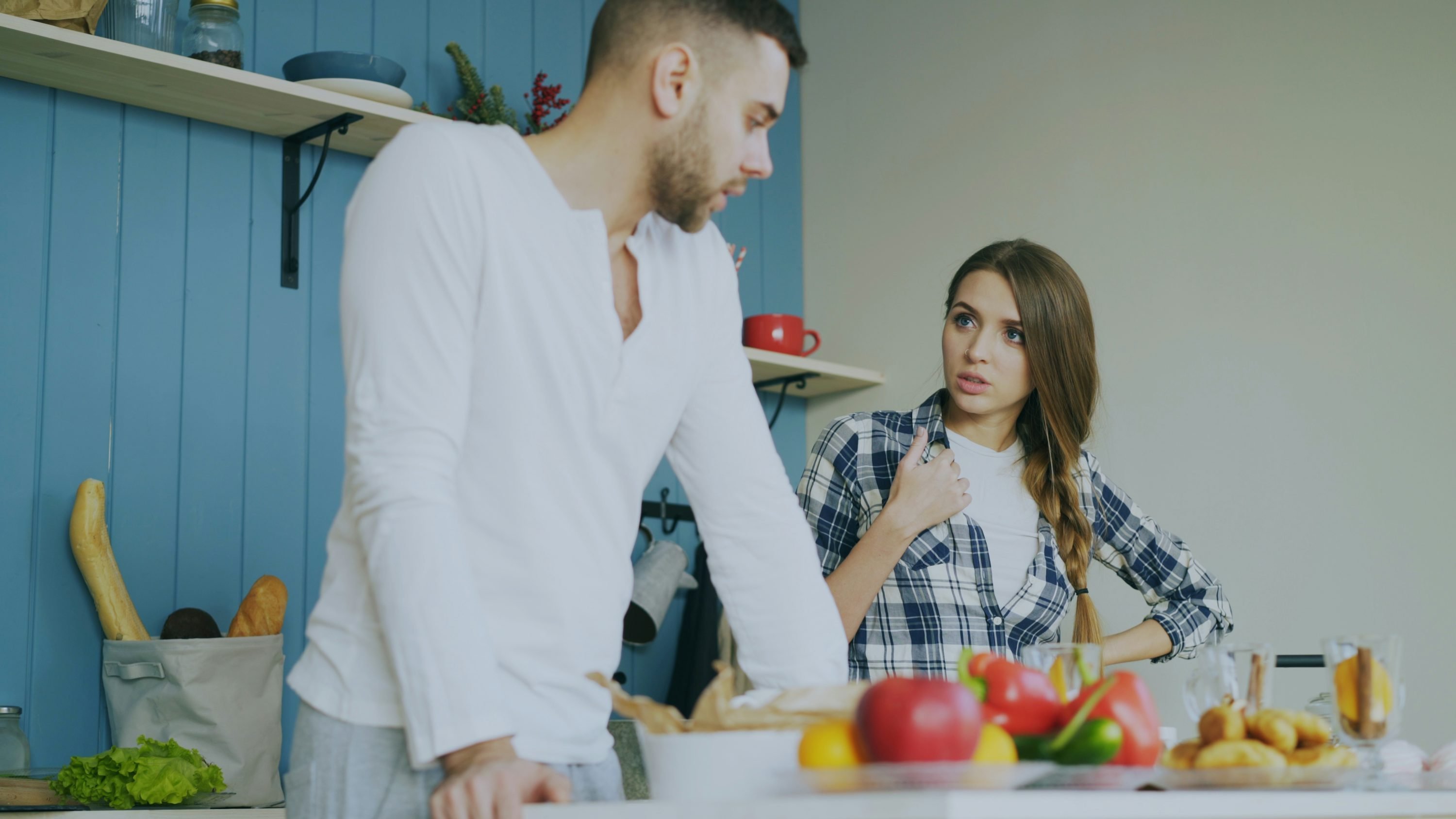Couple arguing kitchen