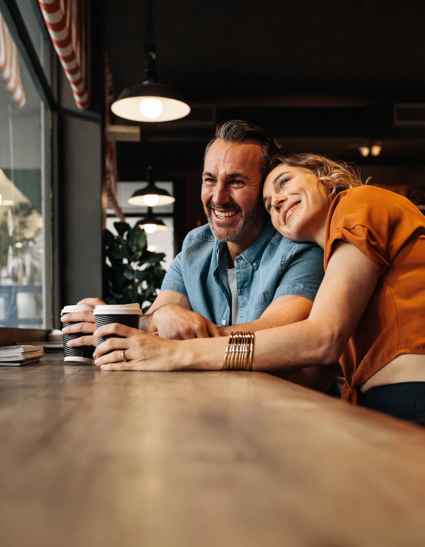 Couple smiling in cafe