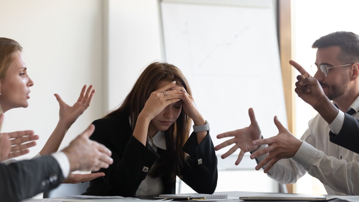 Coworkers debating in meeting