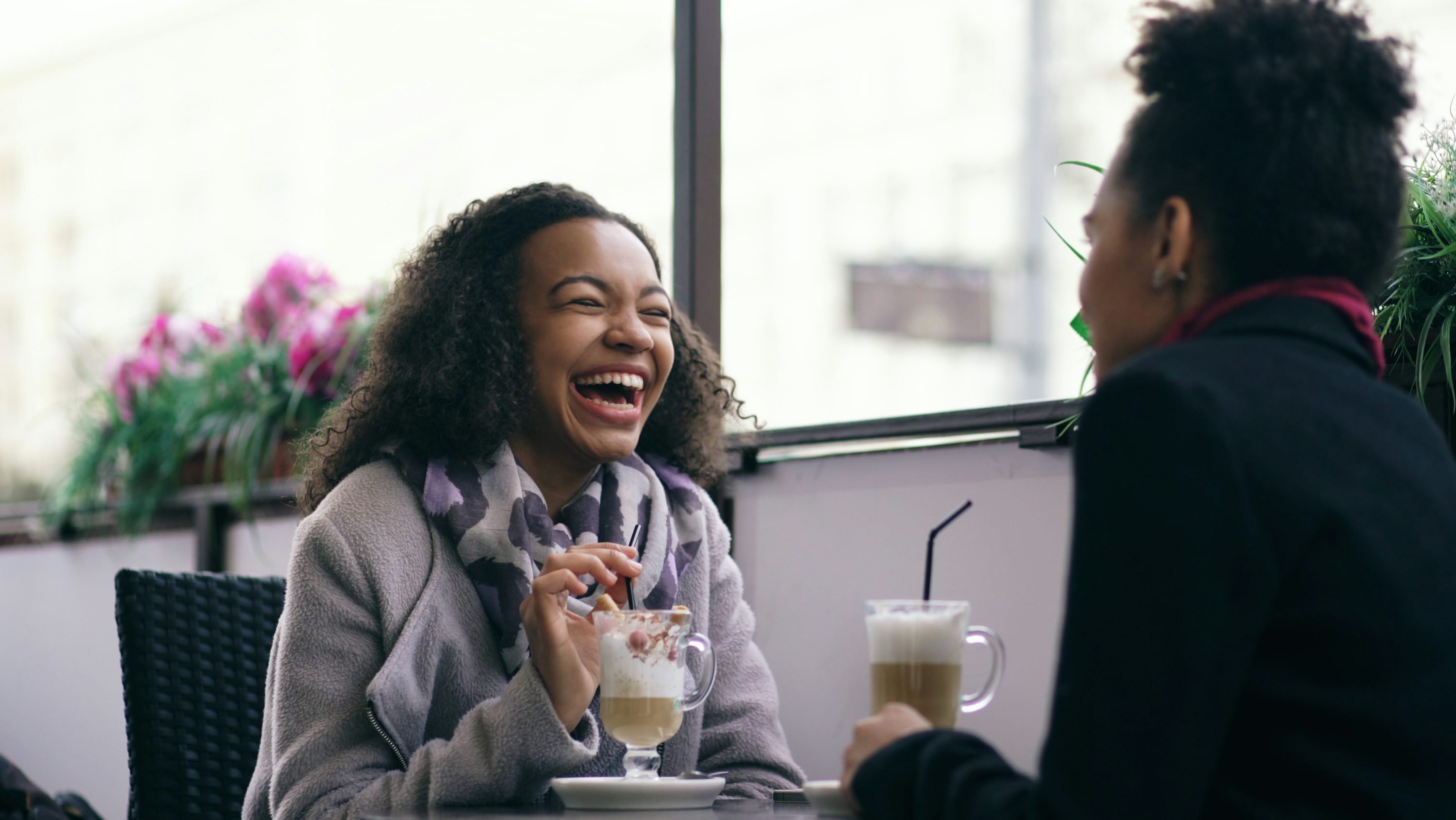 Friends laughing coffee