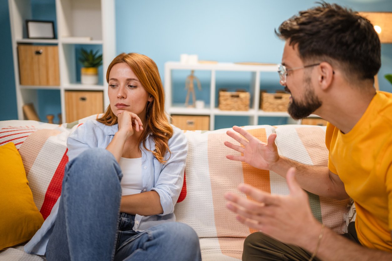 Friends talking on sofa