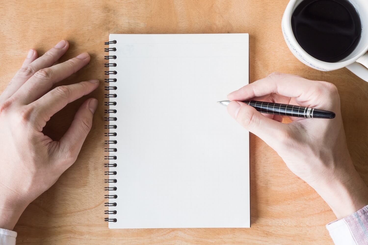Hand writing on paper planner