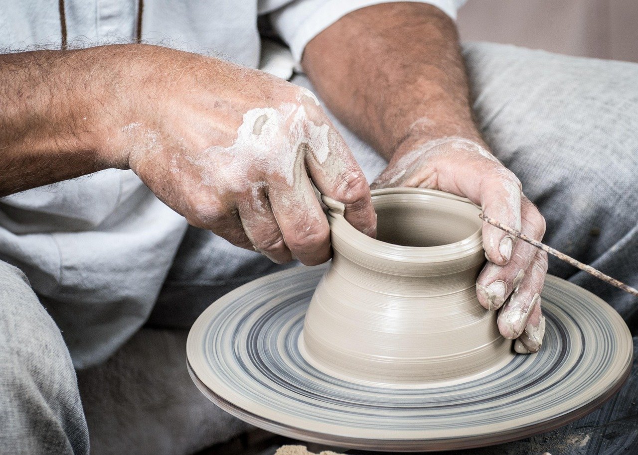 Hands crafting clay