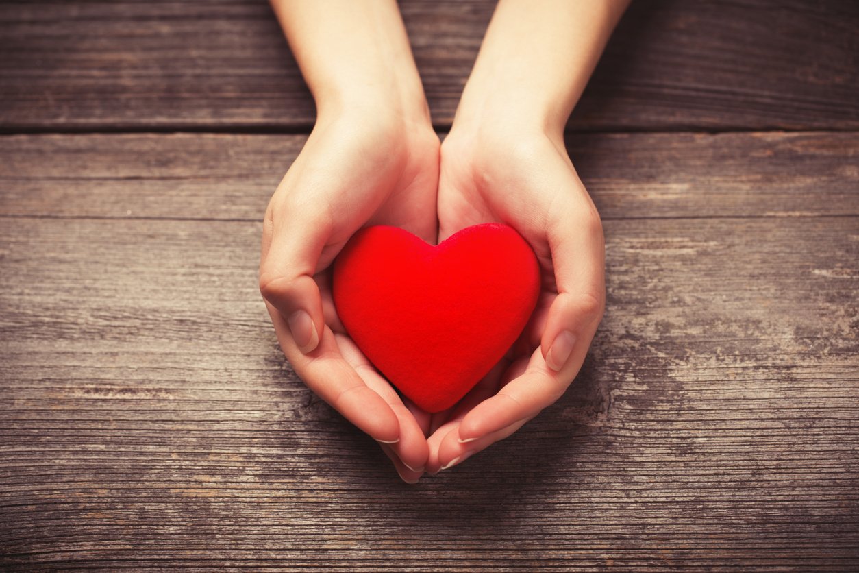 Hands holding heart