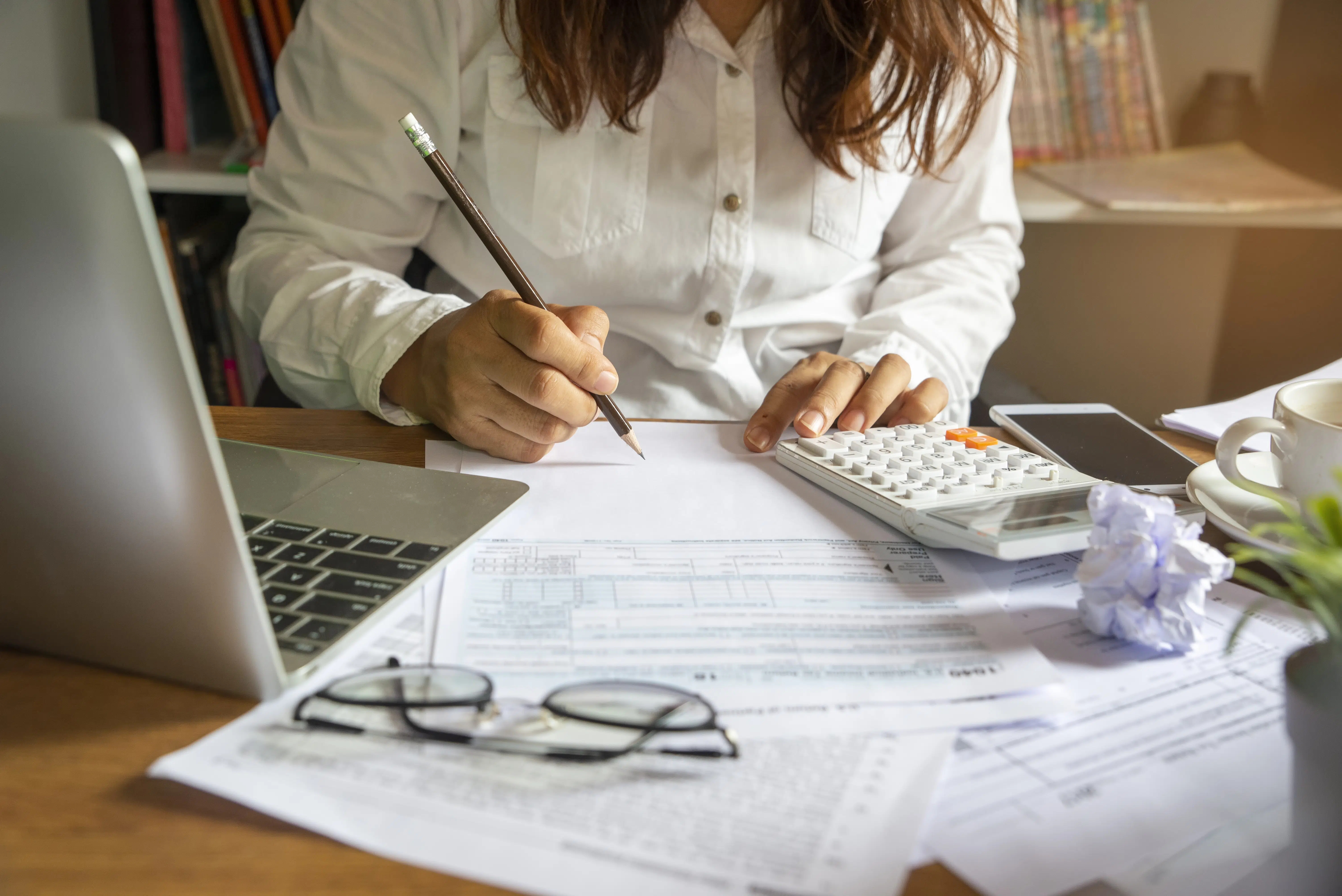 Investor journaling at desk