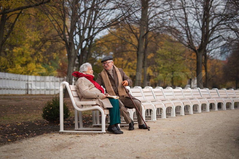 Older couple walking in park