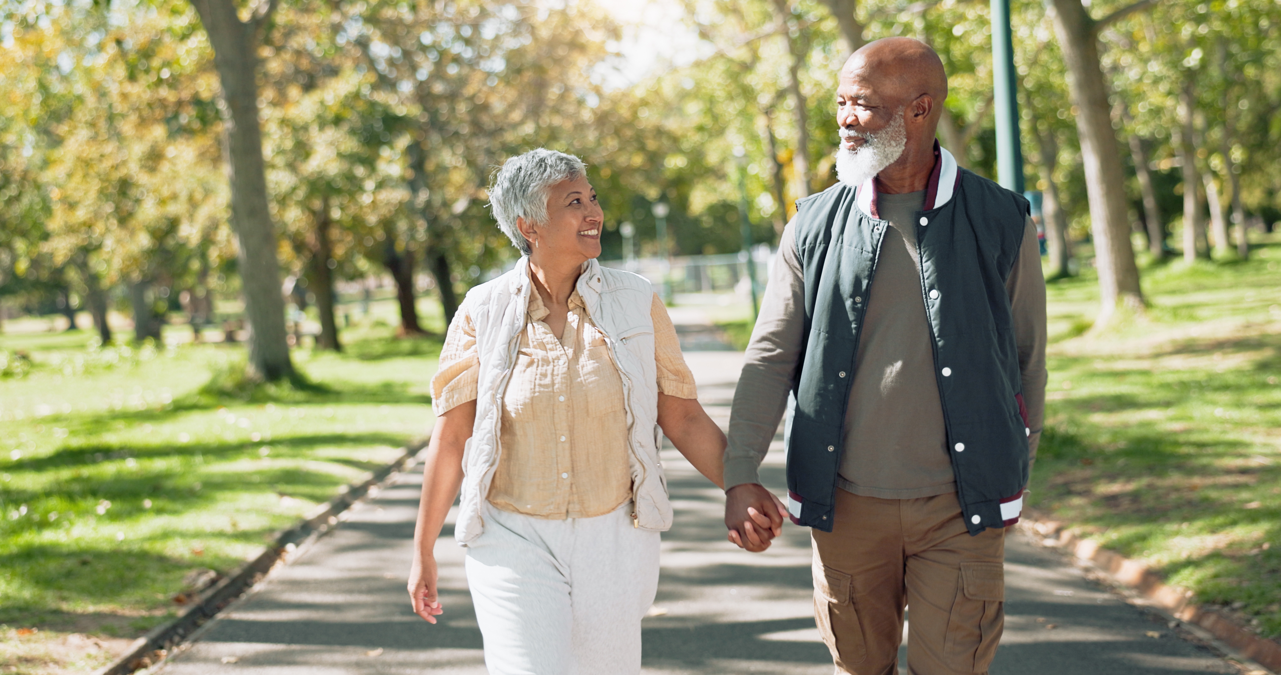 Older people walking in park