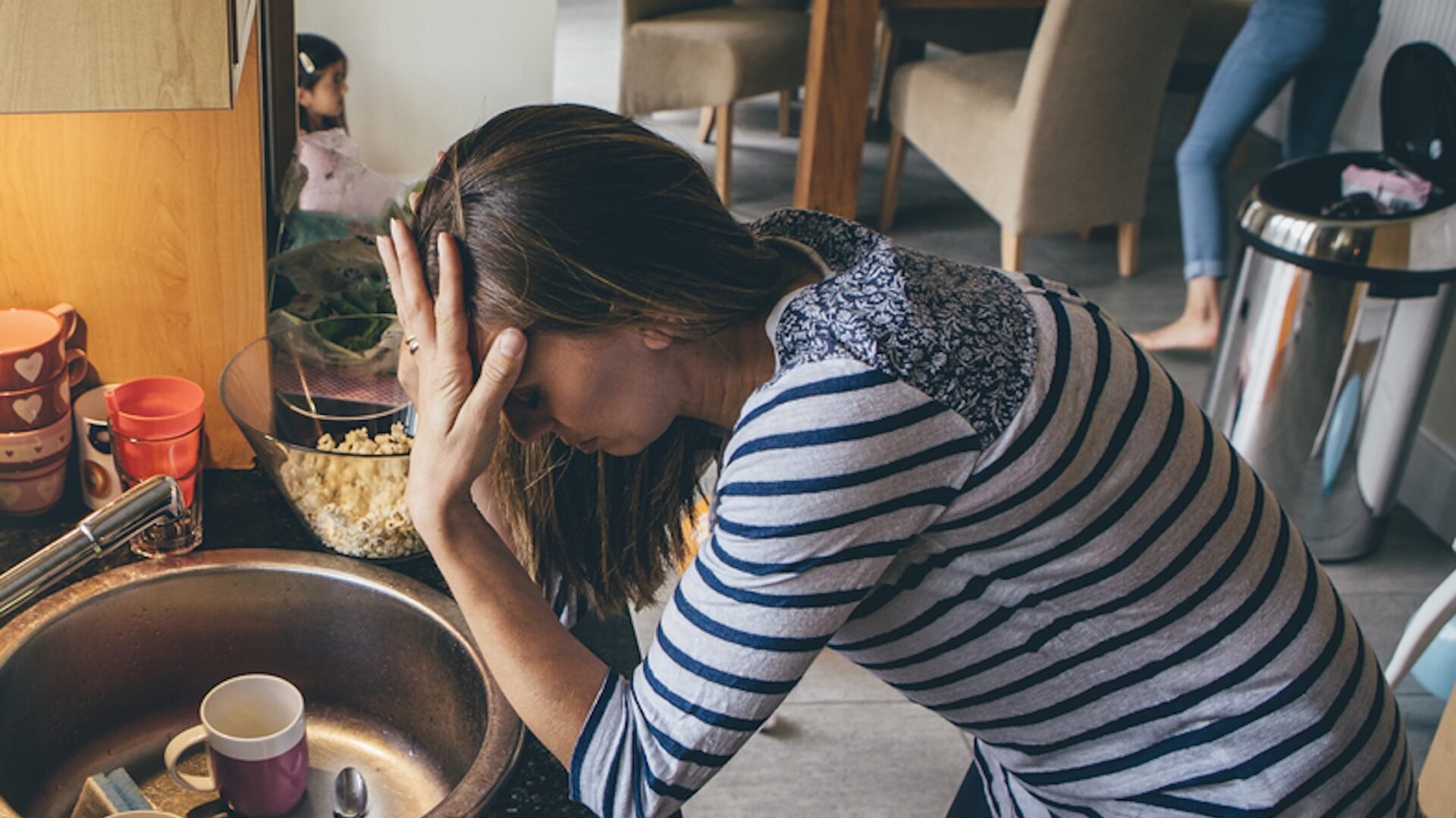 Overwhelmed person kitchen