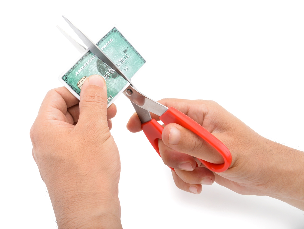 Person cutting up credit card