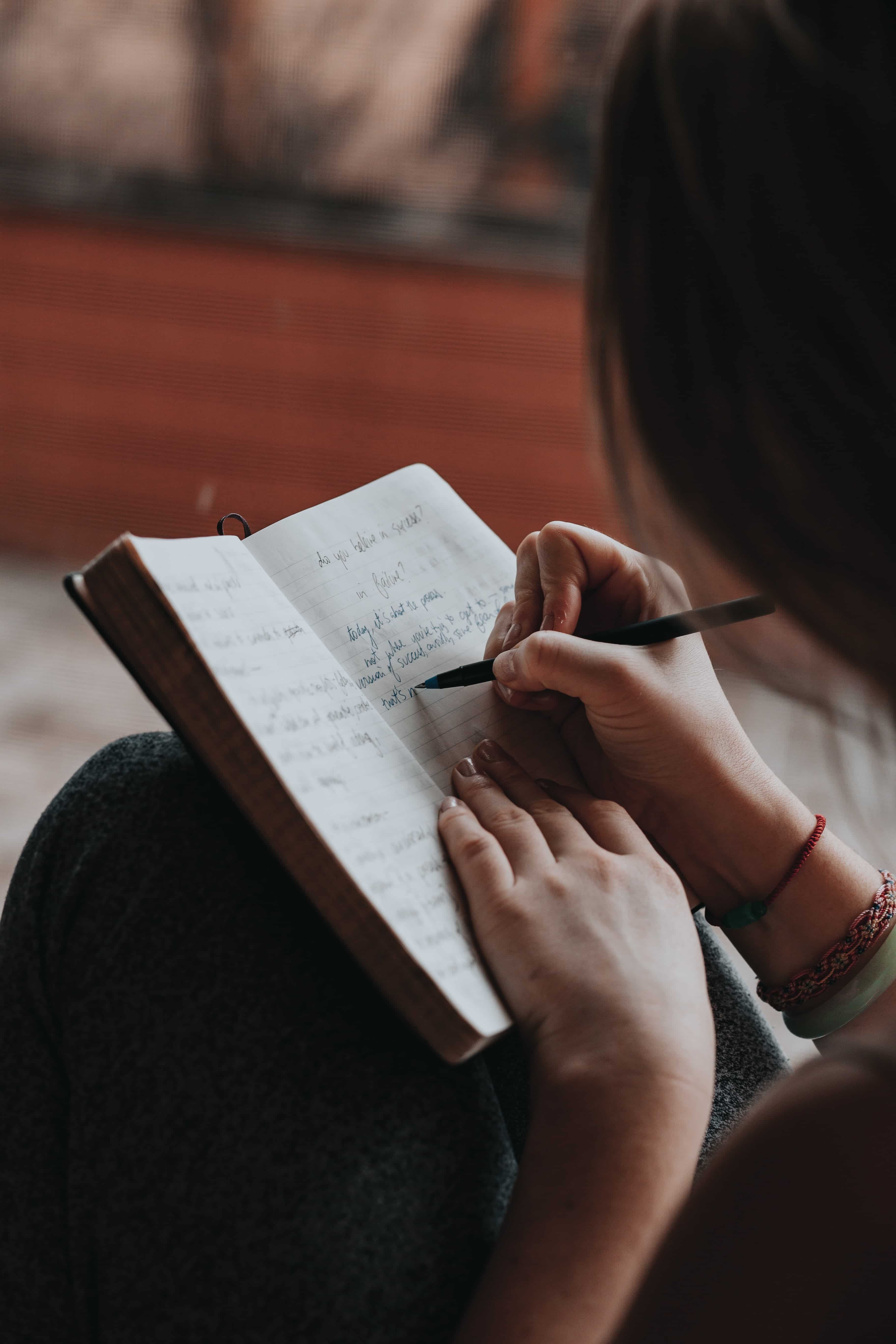 Person journaling inside