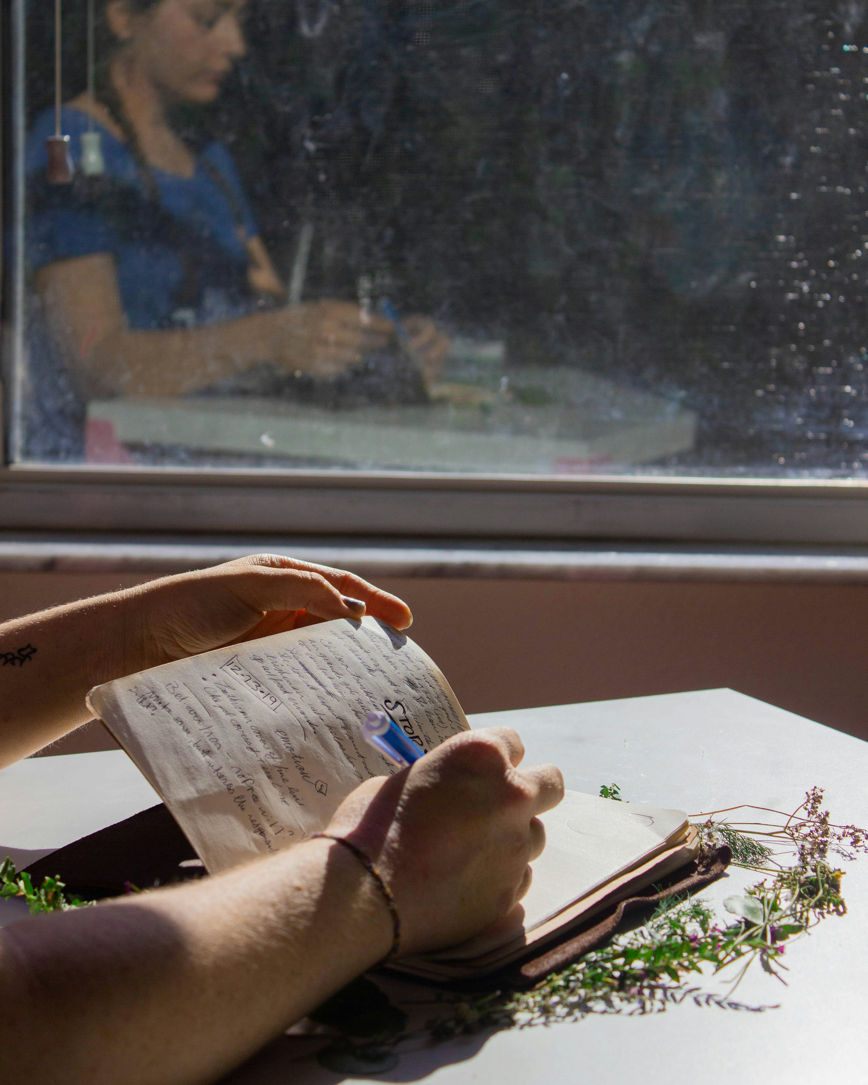 Person journaling window