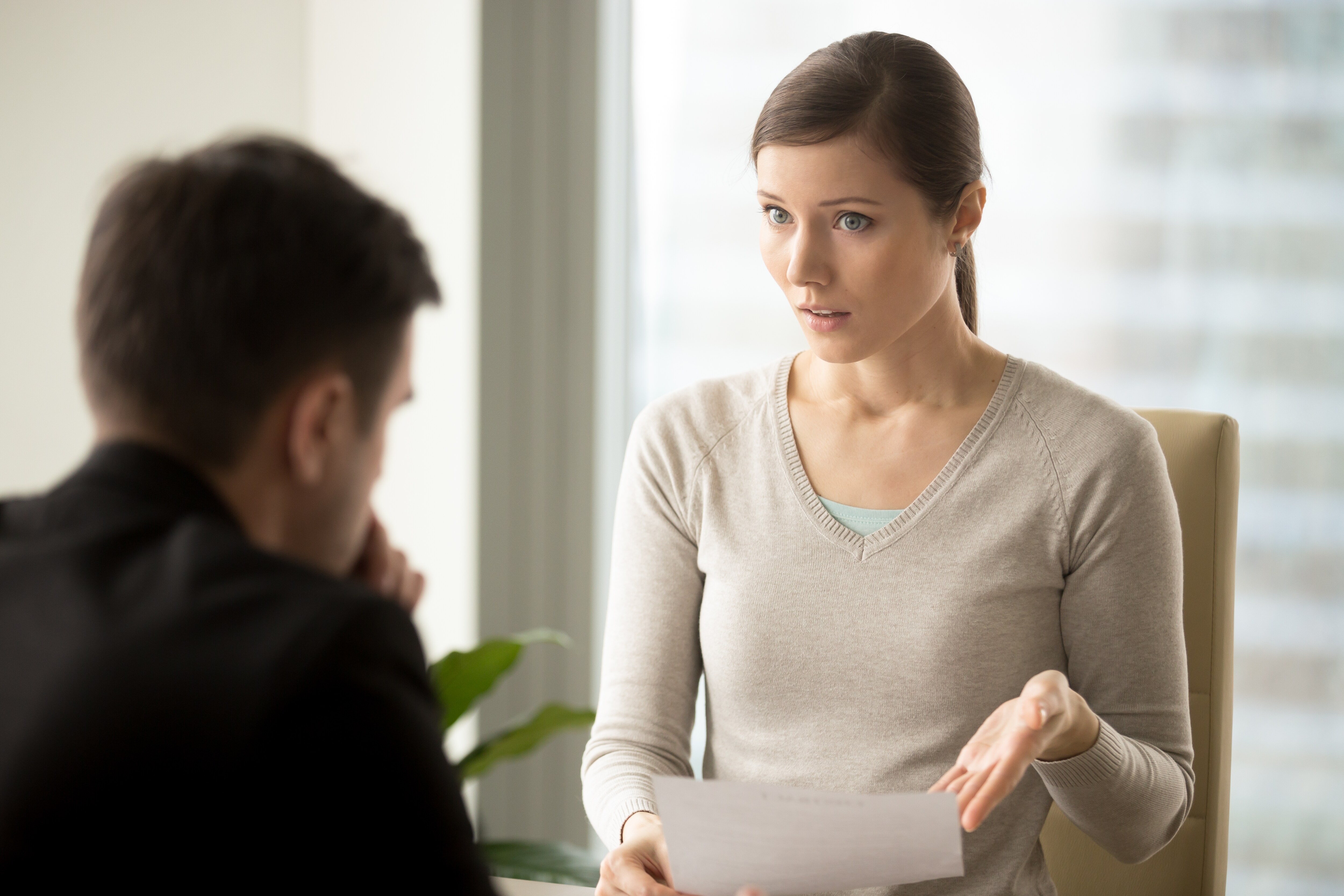 Person looking away during conversation