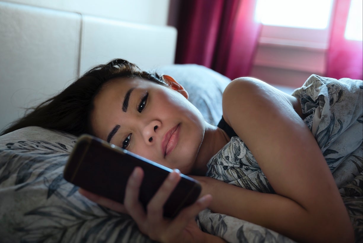 Person scrolling social media feed