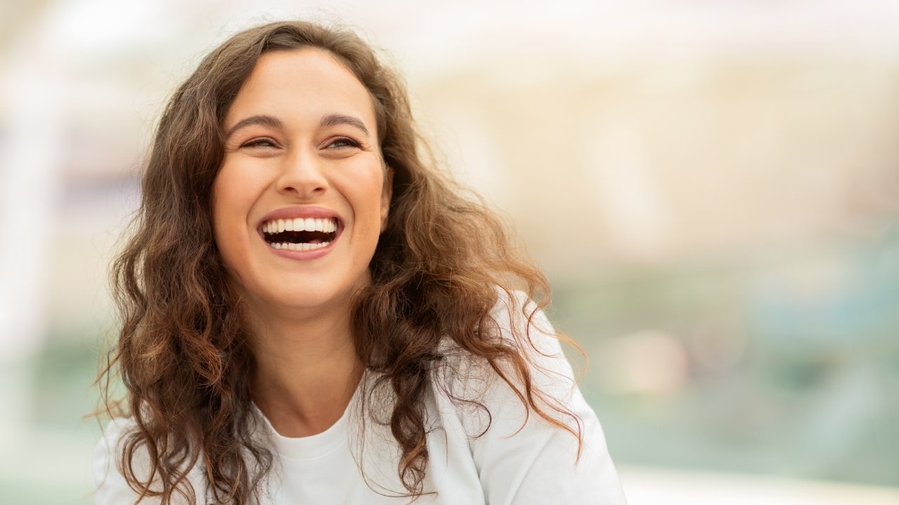 Person smiling outdoors