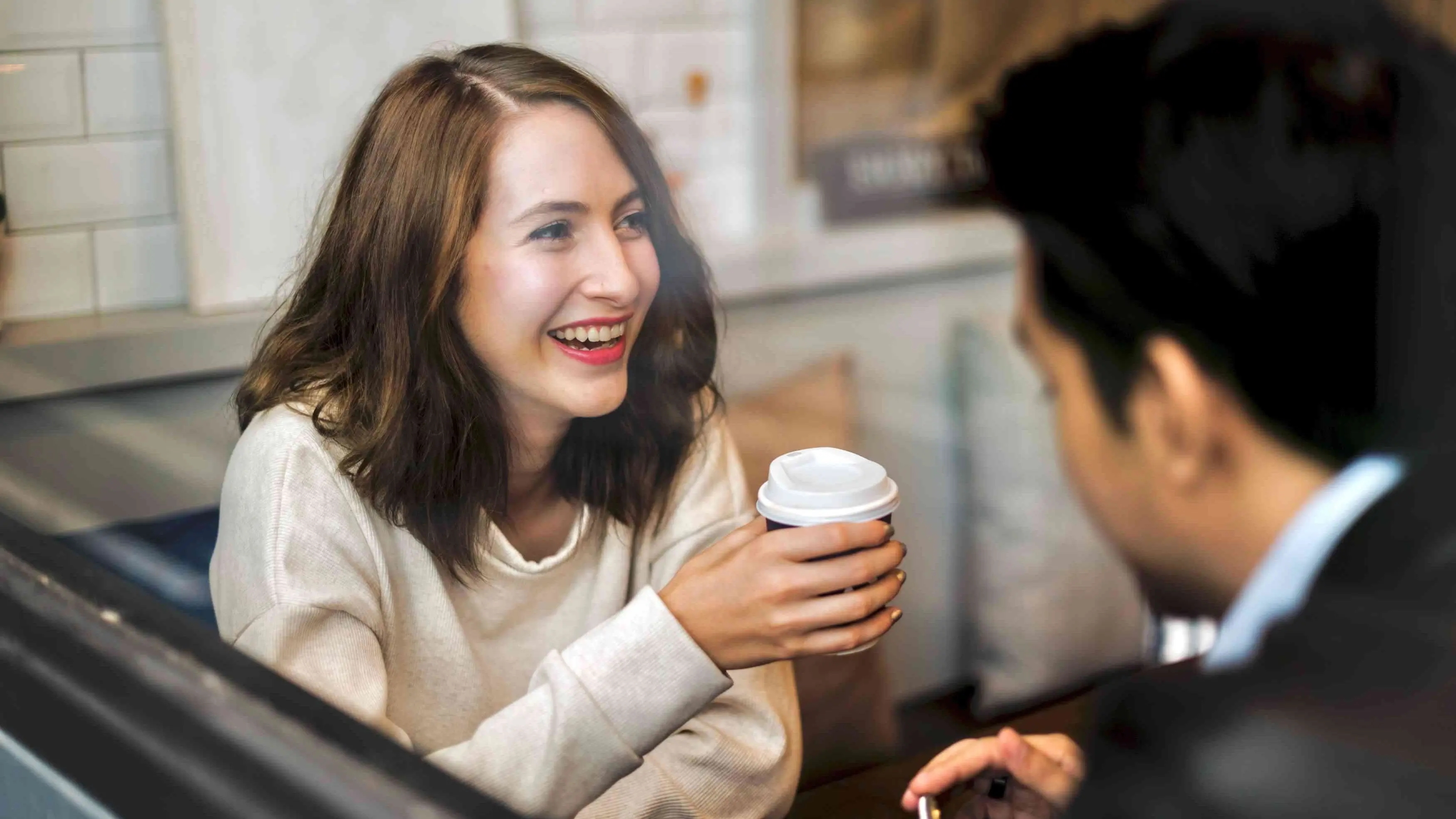 Person speaking honestly over coffee