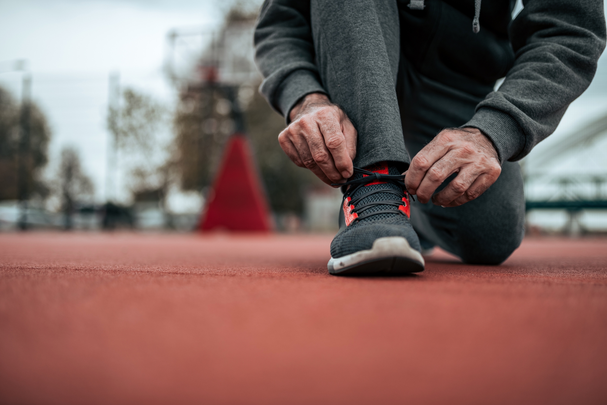 Person tying running shoes