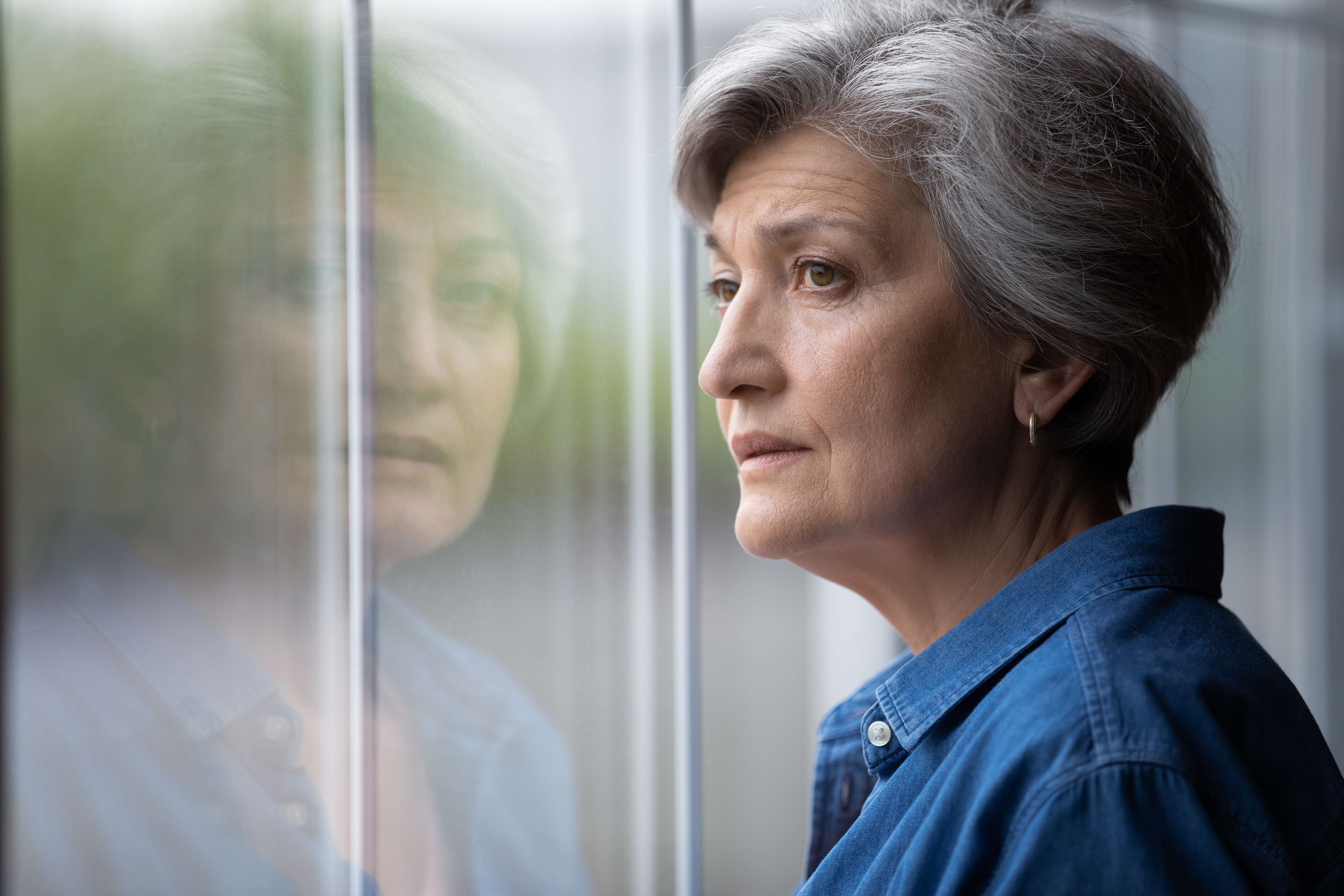 Reflective older adult feeling hopeful
