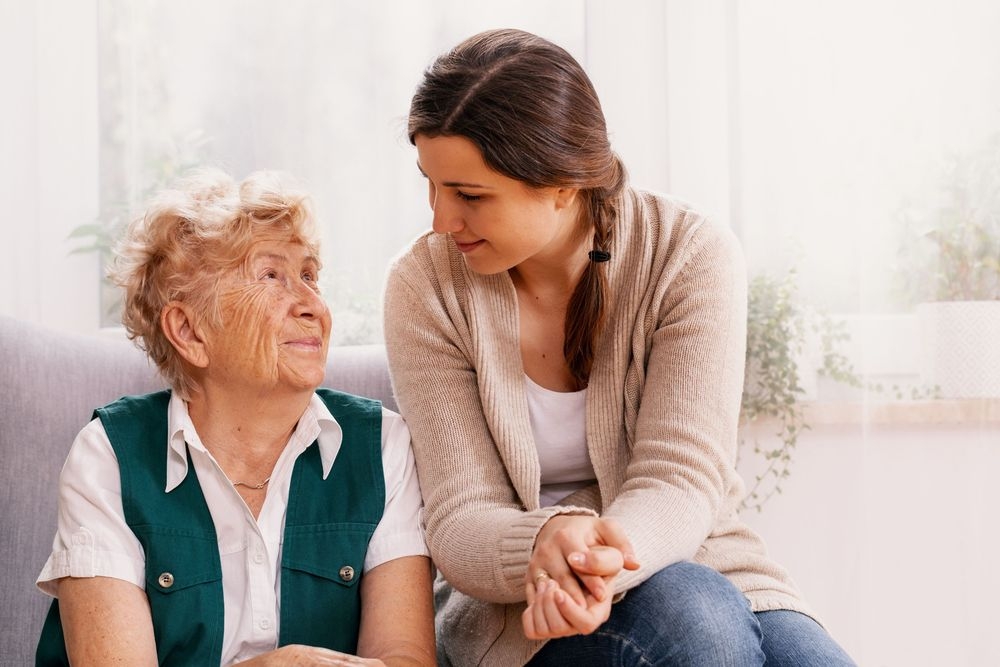Woman helping friend, woman volunteering, woman comforting another person