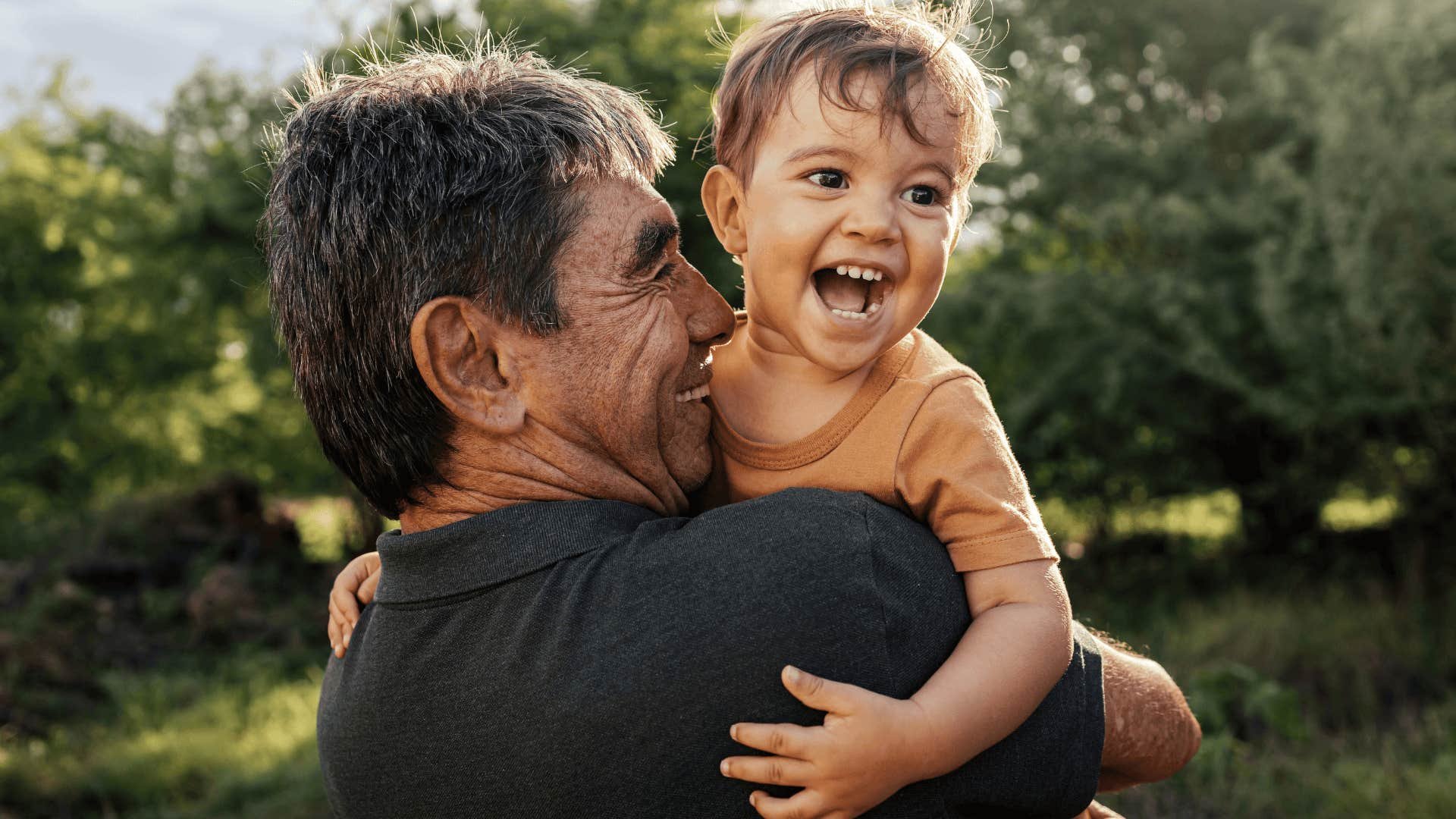 Grandparent hugging child
