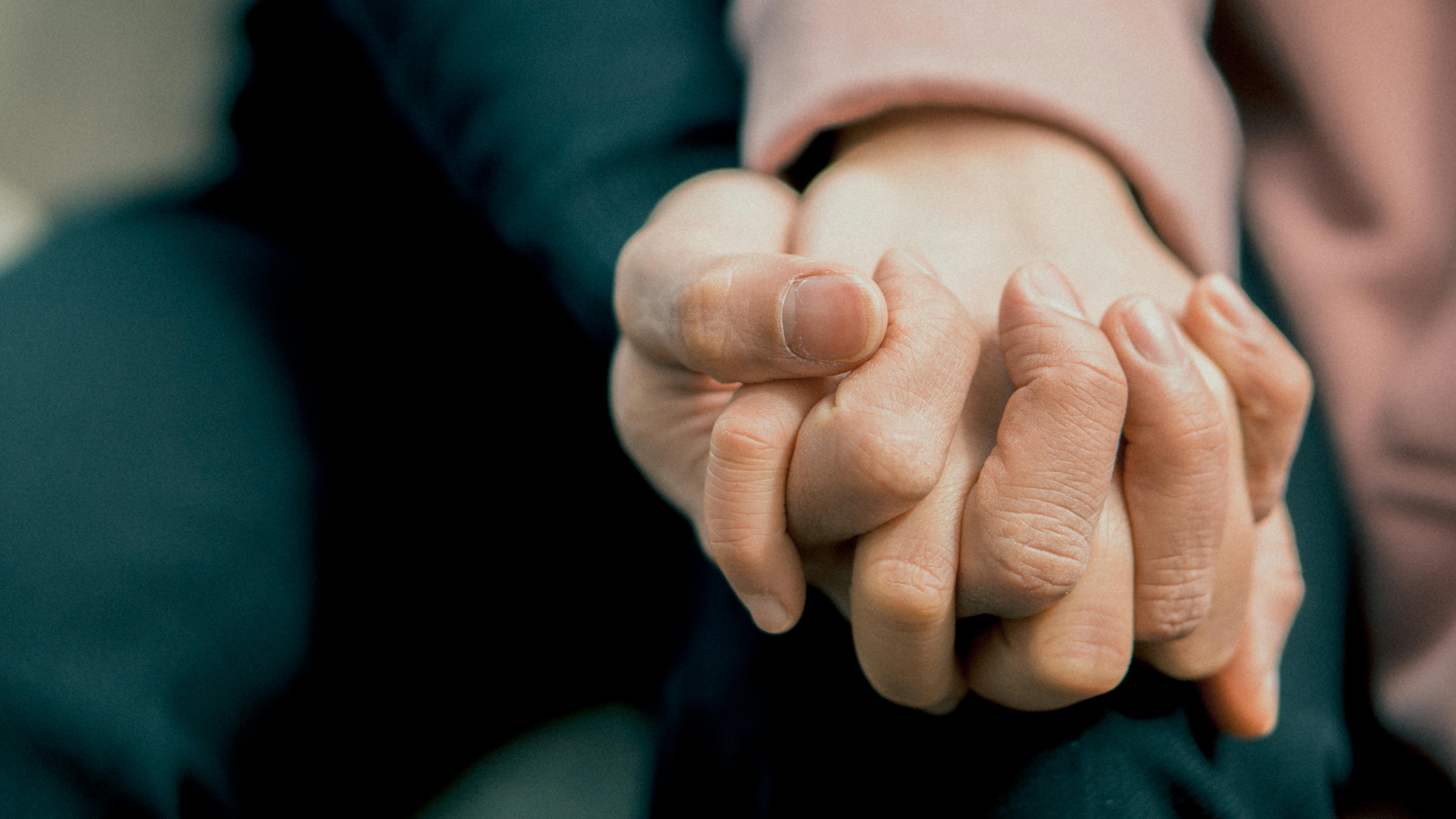 Person holding hands