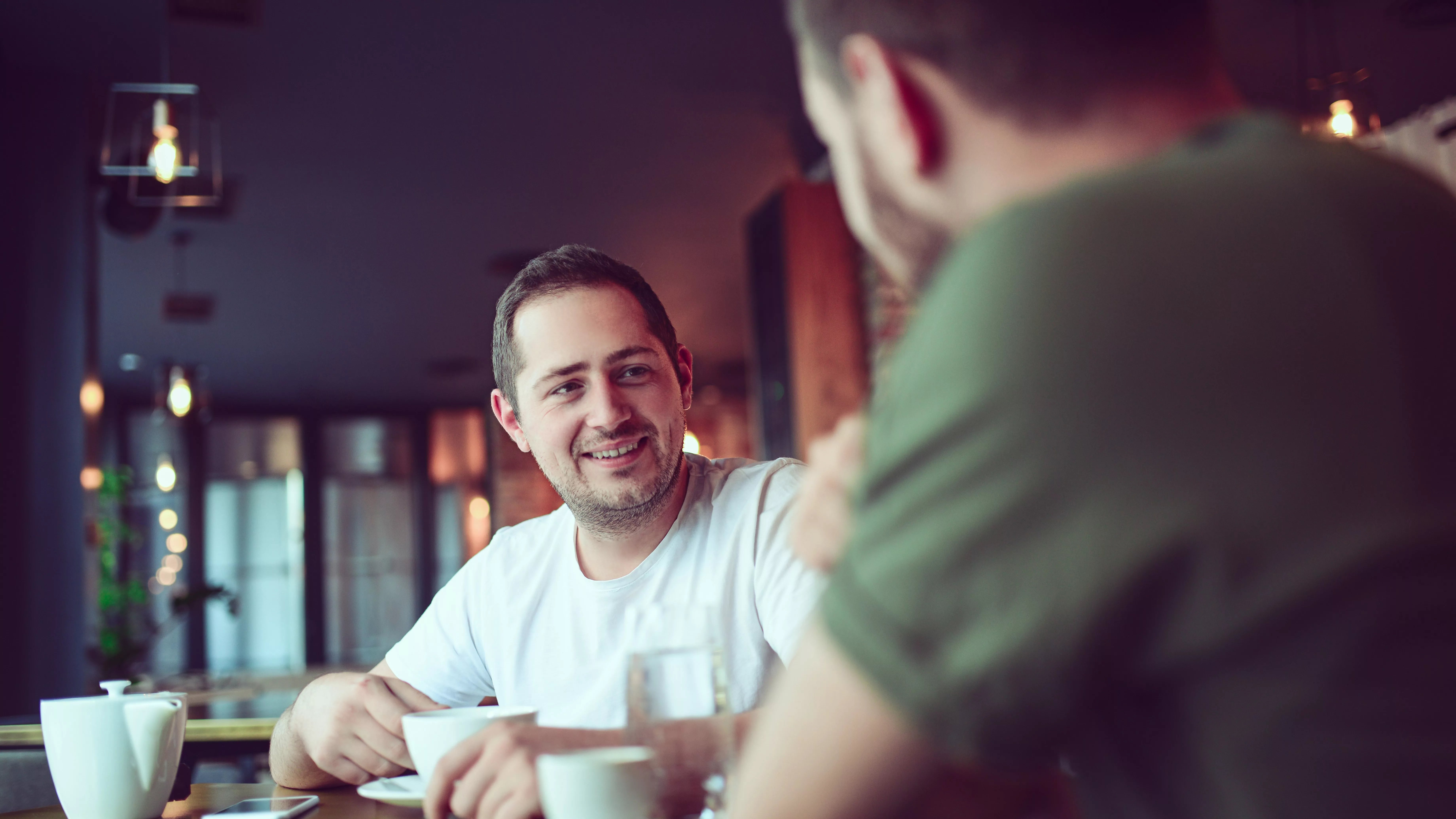 Friends talking cafe