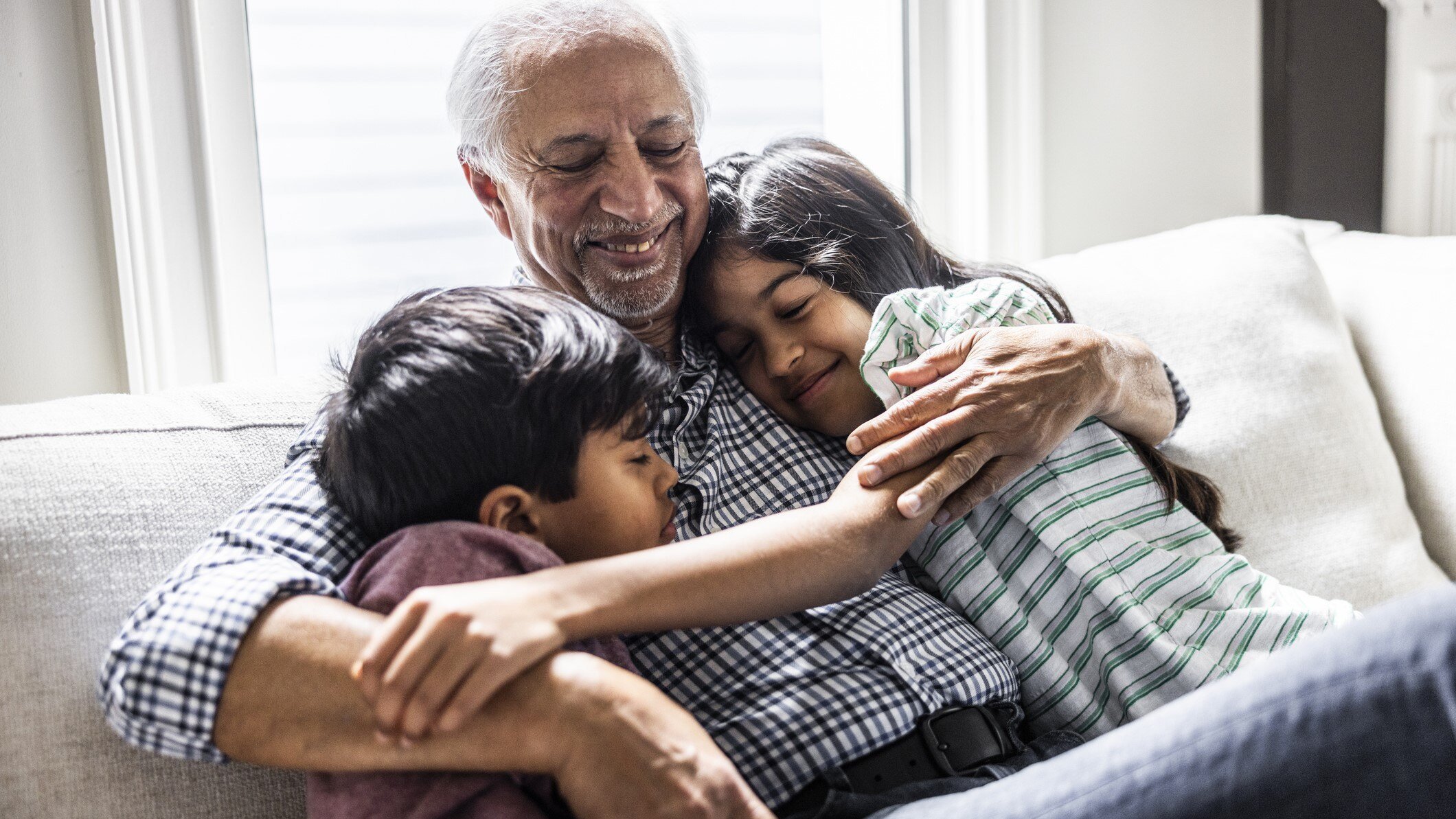 Grandparent hugging grandchild