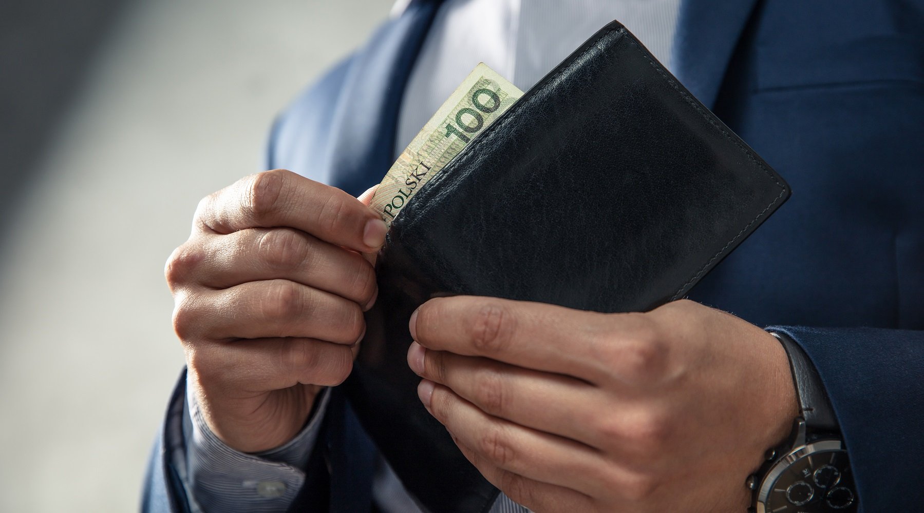 Person holding wallet