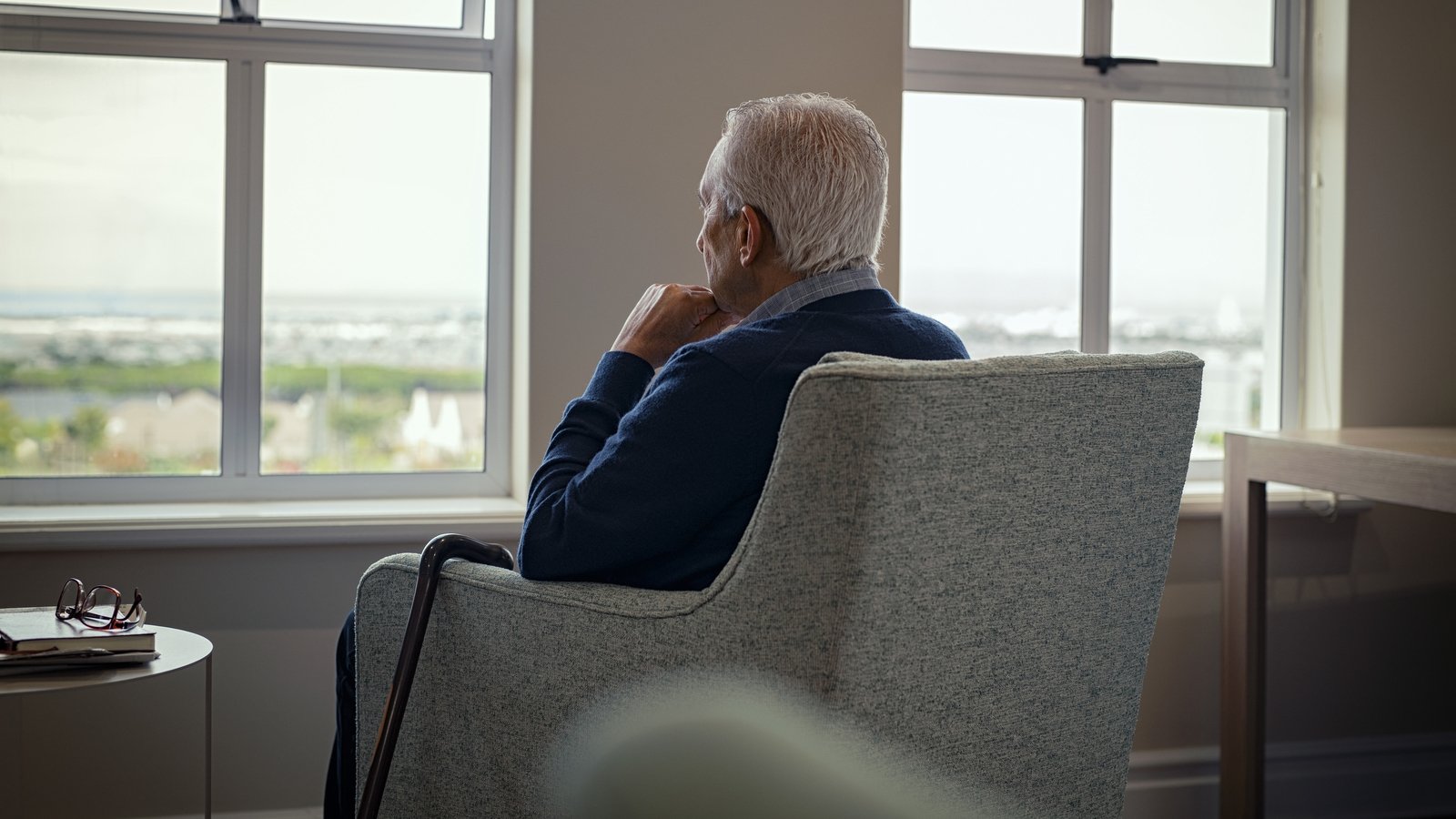 Person looking out window