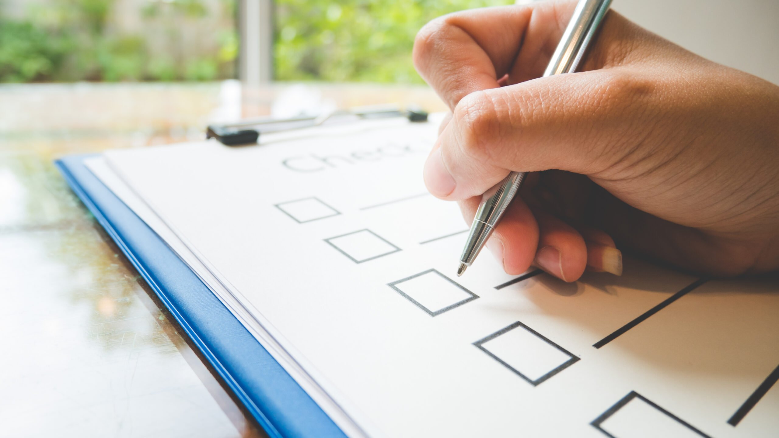 Person writing checklist