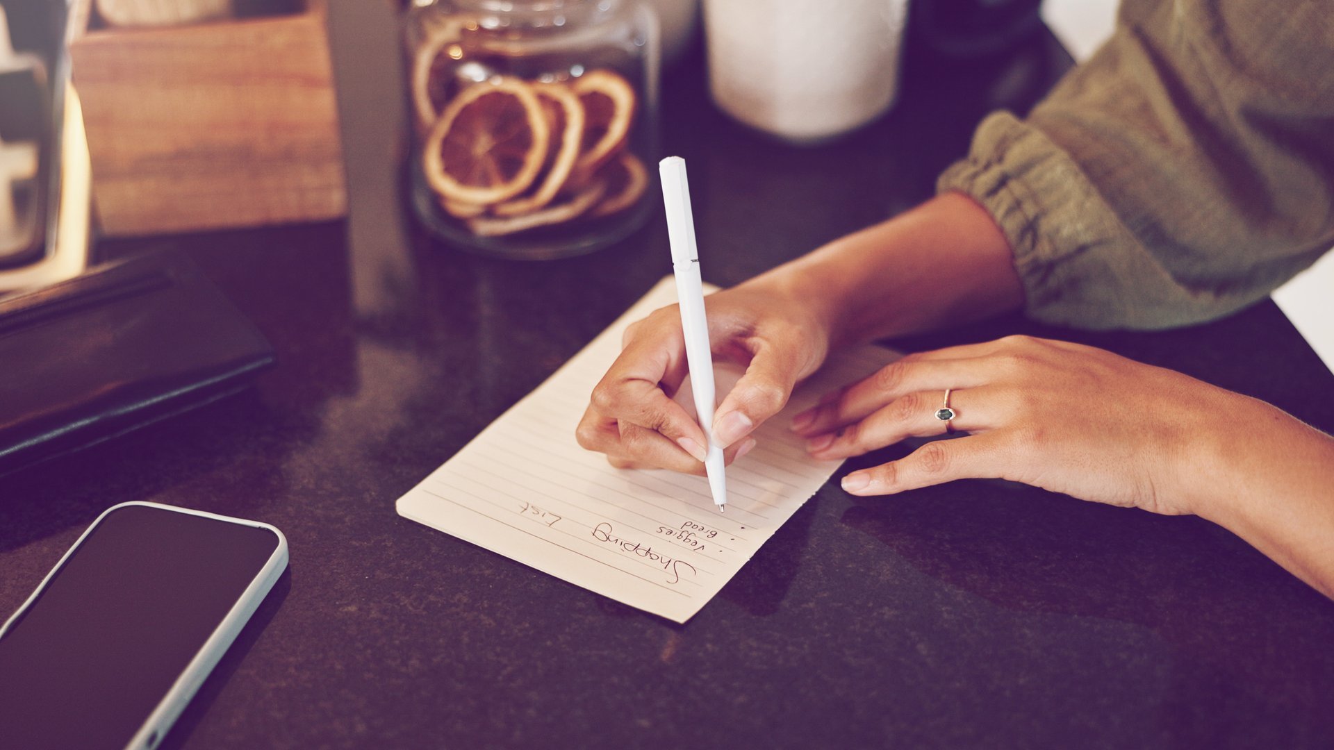Person writing list