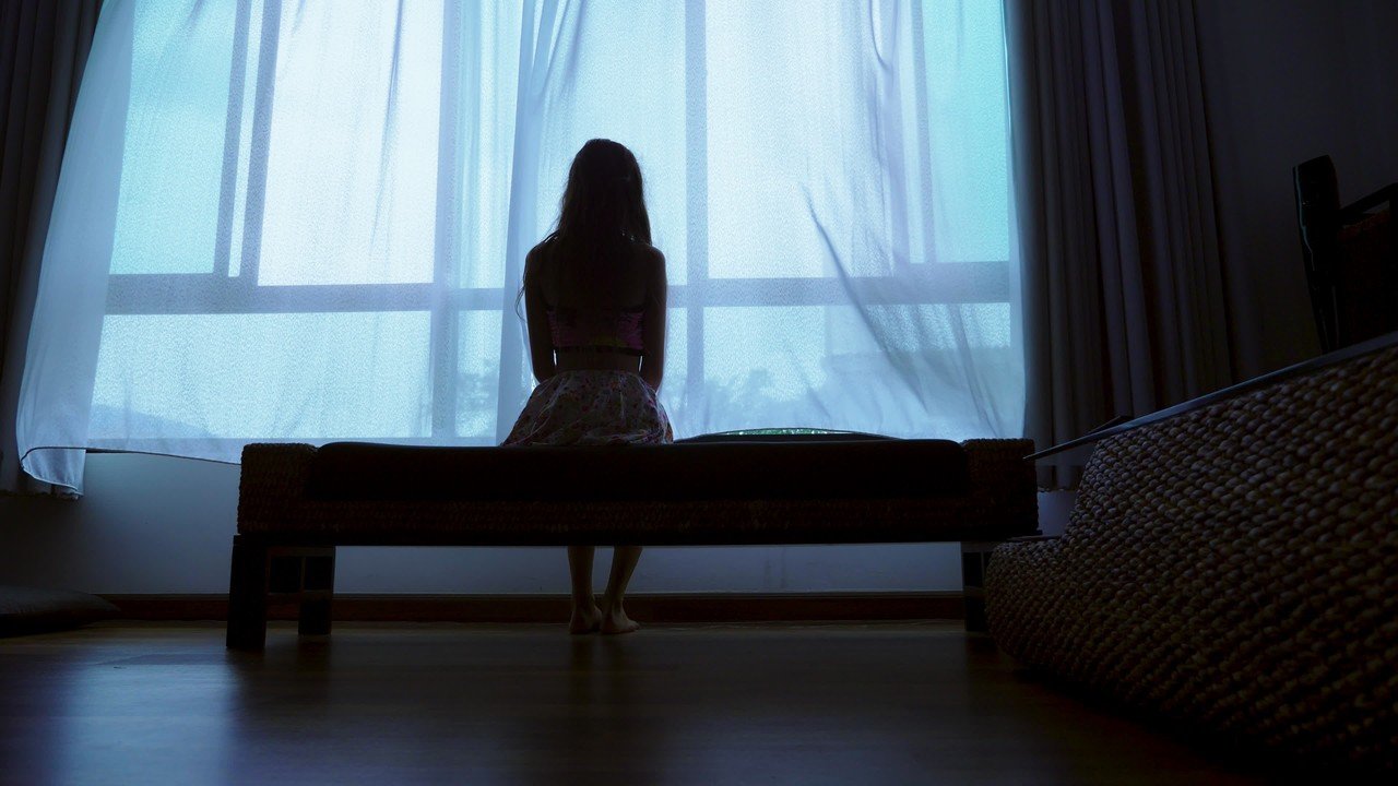 Woman alone window