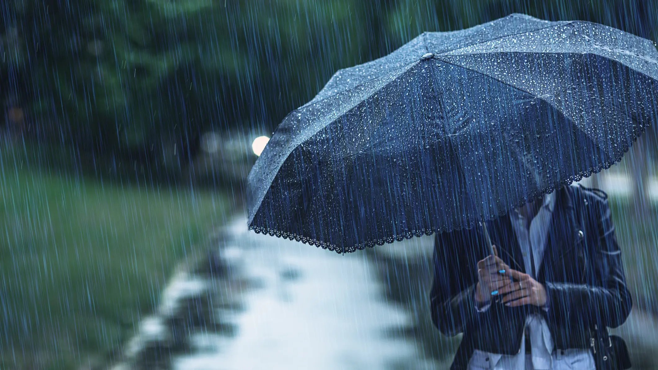 Old woman in rain