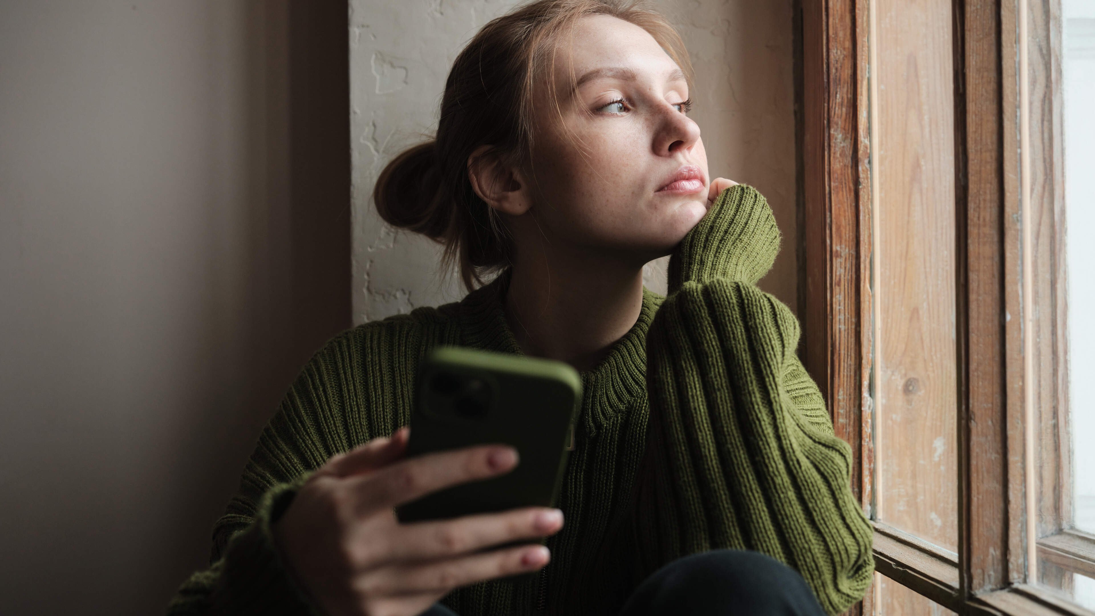 Pensive person texting