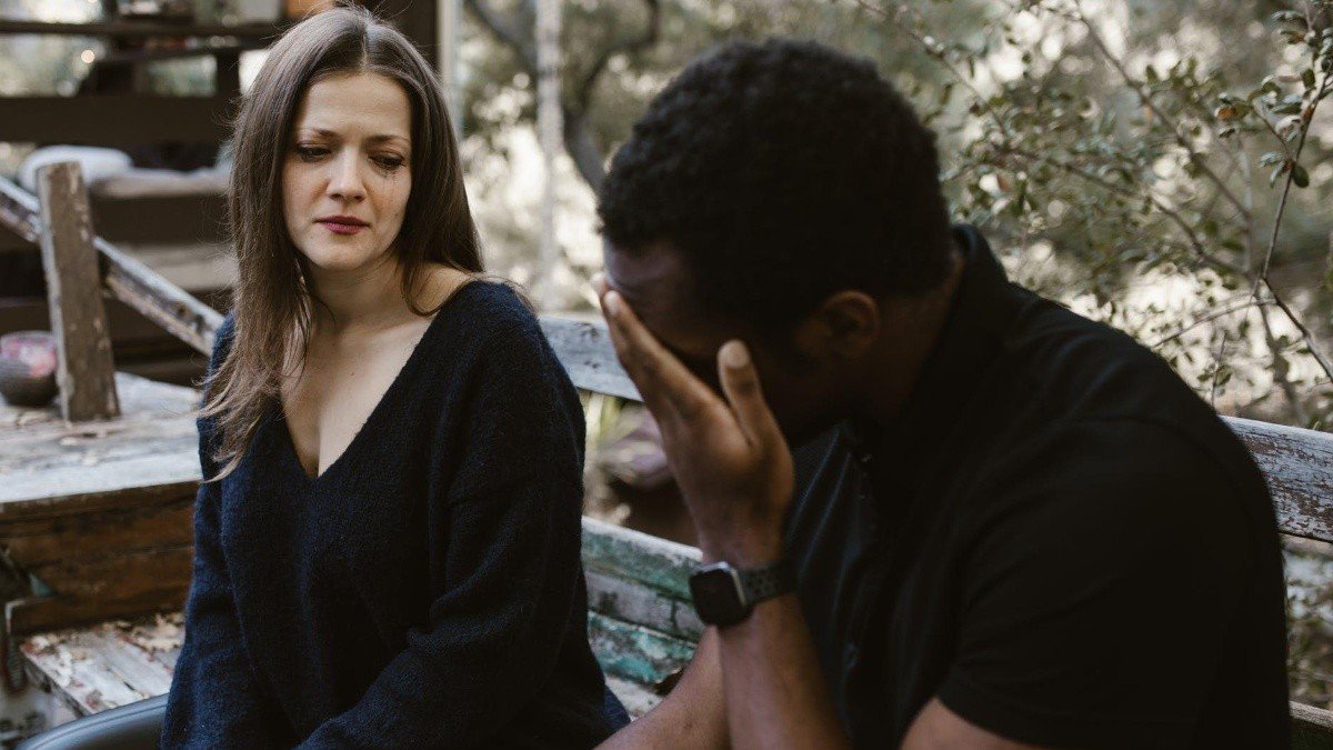 Sad couple talking